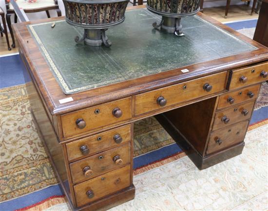 A Victorian mahogany nine drawer pedestal desk W.122cm